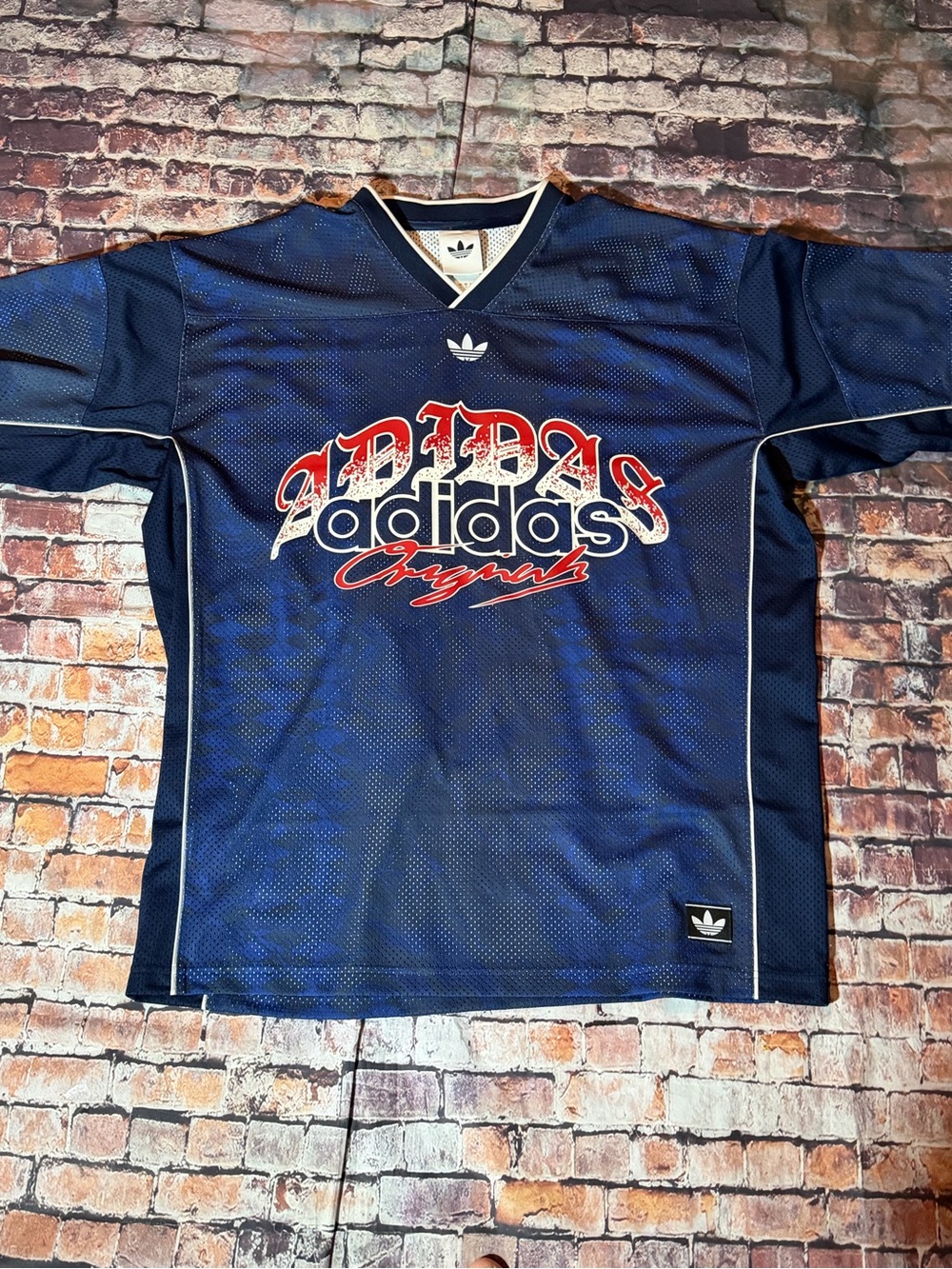 adidas Men’s Navy Blue Graphic Logo Jersey with Red Accents